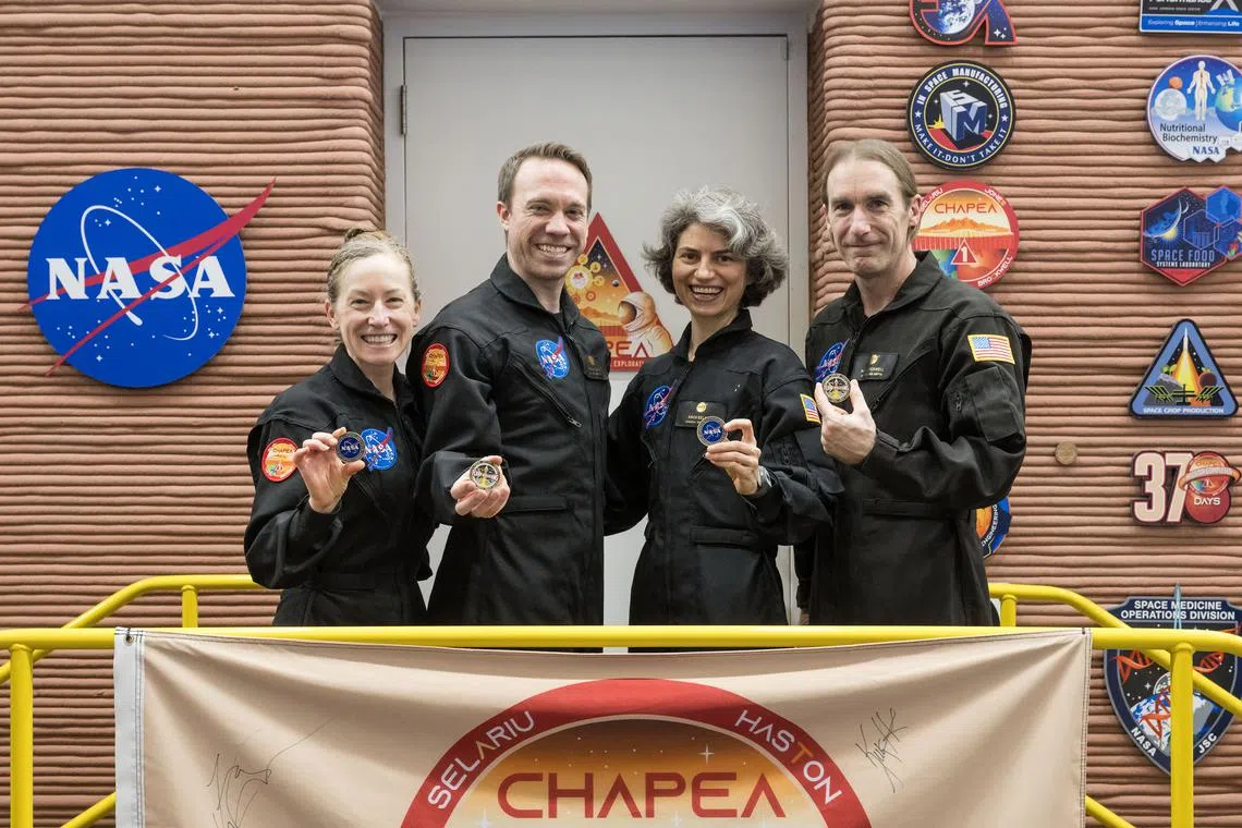 The CHAPEA crew (from left: Kelly Haston, Nathan Jones, Anca Selariu, and Ross Brockwell) egress from their simulated Mars mission July 6 at NASA’s Johnson Space Center in Houston.