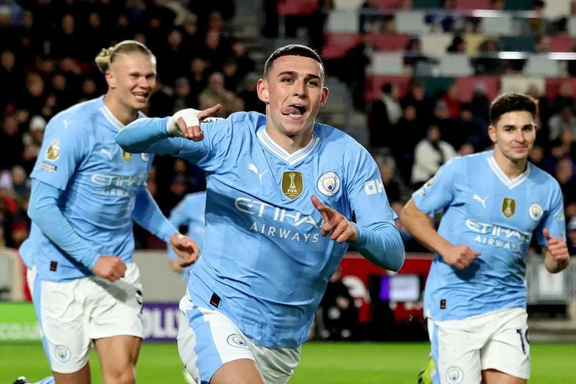 FILE PHOTO: Soccer Football - Premier League - Brentford v Manchester City - Brentford Community Stadium, London, Britain - February 5, 2024 Manchester City's Phil Foden celebrates scoring their second goal with Erling Braut Haaland and Julian Alvarez REUTERS/David Klein/File Photo