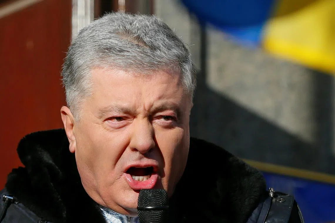 Ukrainian former President Petro Poroshenko, who is suspected of high treason by financing pro-Russian separatists in eastern Ukraine while in office in 2014-2015, addresses his supporters outside a court building before a hearing in Kyiv, Ukraine January 19, 2022. REUTERS/Gleb Garanich/ File Photo
