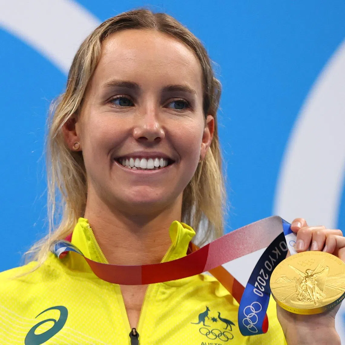 FILE PHOTO: Tokyo 2020 Olympics - Swimming - Women's 100m Freestyle - Medal Ceremony - Tokyo Aquatics Centre - Tokyo, Japan - July 30, 2021. Emma McKeon of Australia poses on the podium with the gold medal REUTERS/Marko Djurica/File Photo