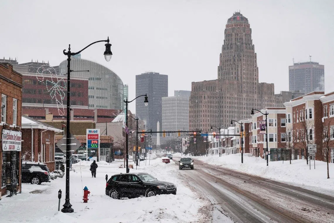 Snow continues to fall on Niagra Street in Buffalo, New York.