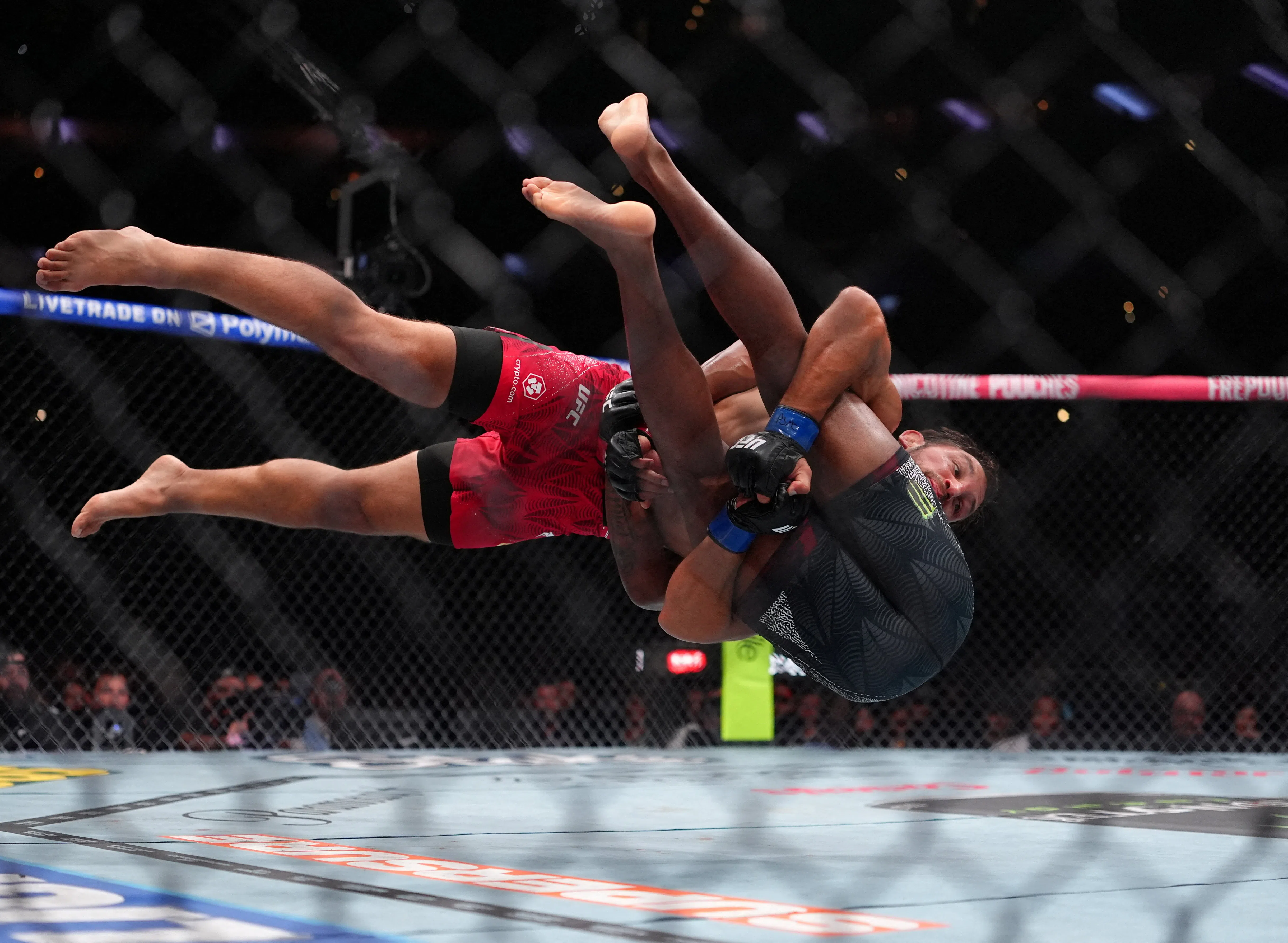 Aug 15, 2026; Philadelphia, Pennsylvania, USA; Mansur Abdul-Malik (red gloves) fights against Dustin Stoltzfus (blue gloves) during the middleweight bout during UFC 330 at Xfinity Mobile Arena. Mandatory Credit: Kyle Ross-Imagn Images     TPX IMAGES OF THE DAY