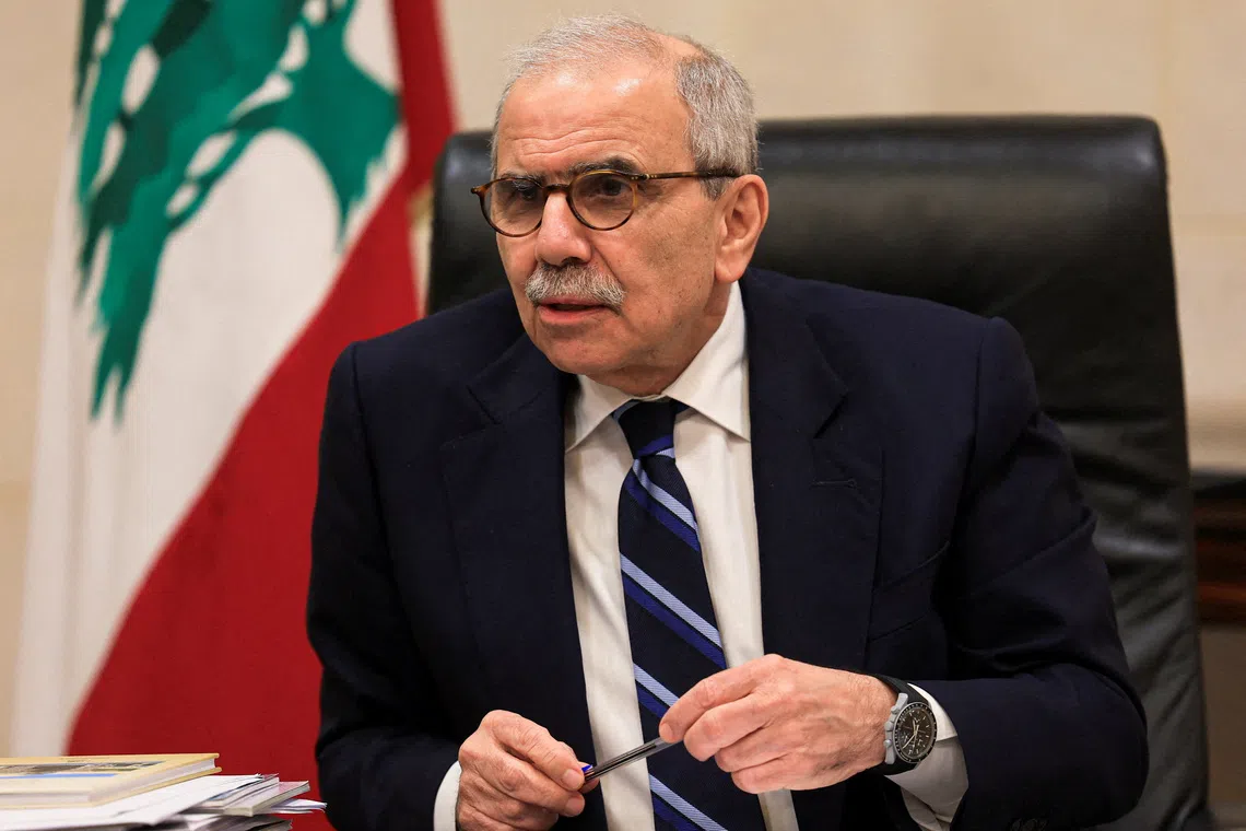 FILE PHOTO: Lebanese Prime Minister Nawaf Salam speaks to journalists at the government headquarters in Beirut, Lebanon, December 3, 2025. REUTERS/Mohamed Azakir/File Photo