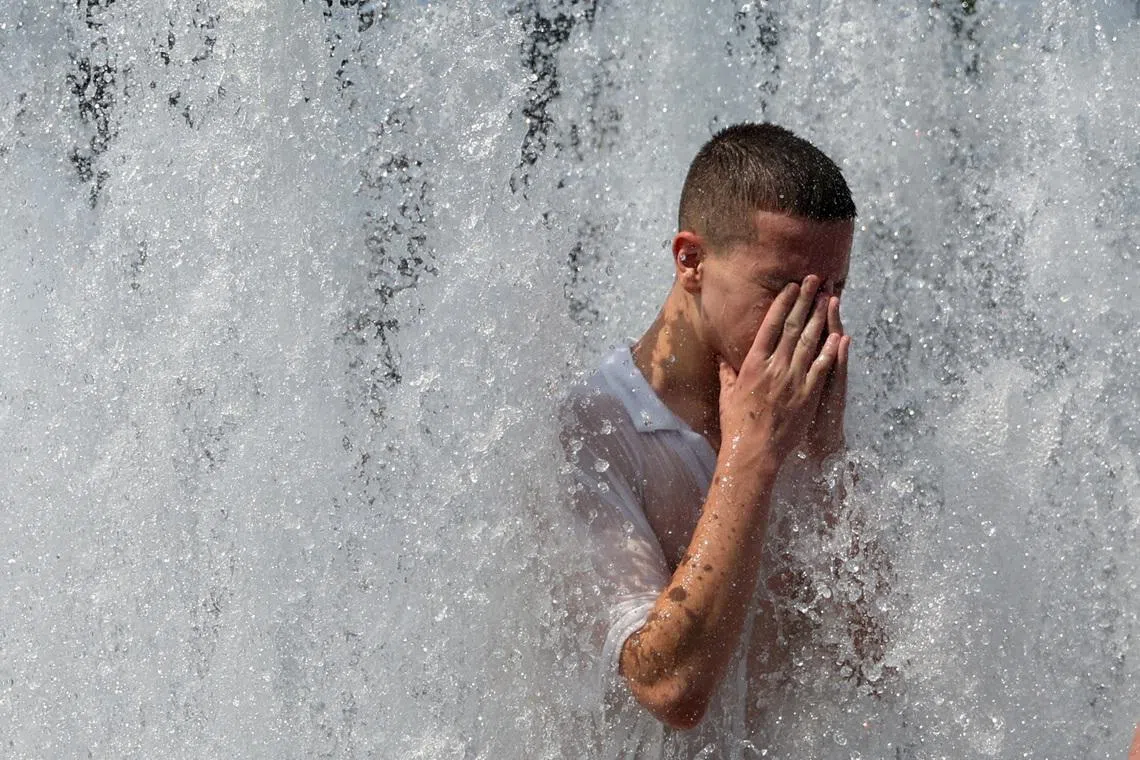 A person cools off in the fountain in front of the Berlin Cathedral Berliner Dom during the ongoing heatwave in Berlin, Germany, June 28, 2026. REUTERS/Maryam Majd TPX IMAGES OF THE DAY