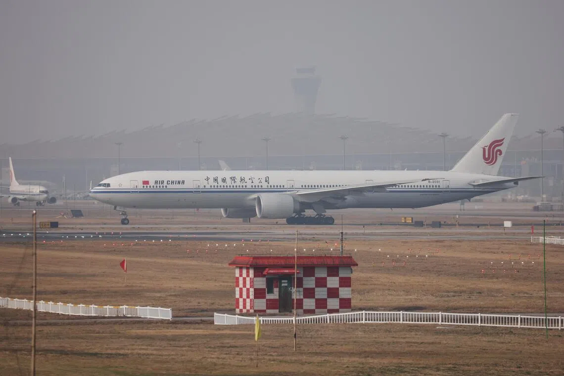 An Air China passenger airplane lands at Beijing Capital International Airport in China, on March 26, 2026. The airline said it will raise its fuel surcharge on domestic flights.