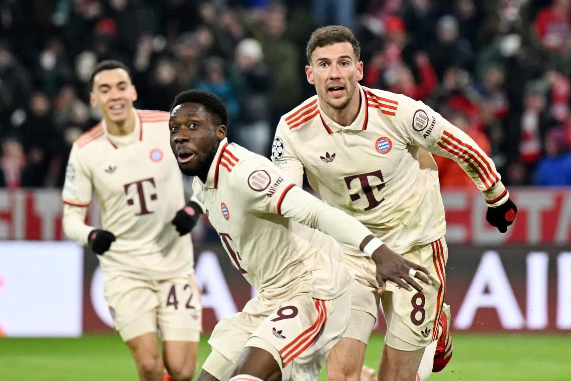 Soccer Football - Champions League - Knockout Phase Playoff - Second Leg - Bayern Munich v Celtic - Allianz Arena, Munich, Germany - February 18, 2025 Bayern Munich's Alphonso Davies celebrates scoring their second goal with Leon Goretzka REUTERS/Angelika Warmuth