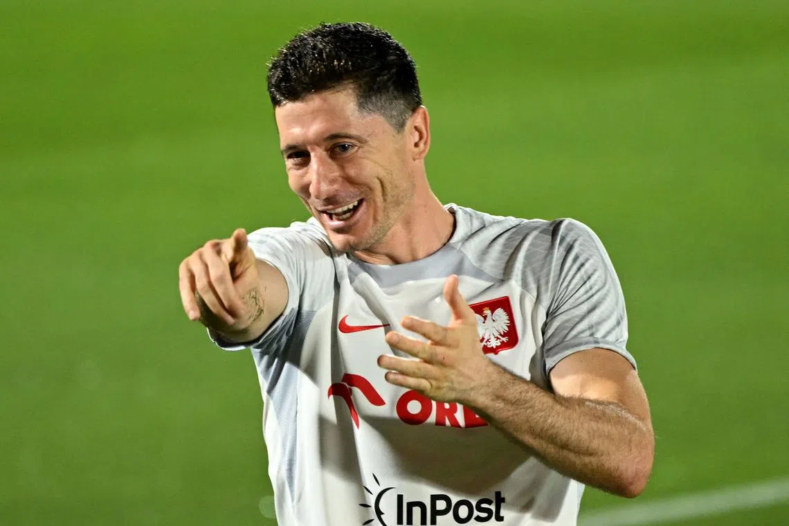 Poland's forward Robert Lewandowski having a light moment during a training session in Doha on Nov 18, ahead of their World Cup opener against Mexico on Tuesday.