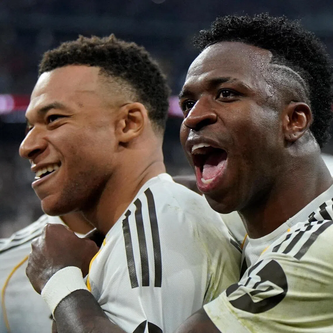Real Madrid's Kylian Mbappe (left) celebrates scoring a late winner in the 2-1 La Liga triumph over Rayo Vallecano with Vinicius Jr at the Santiago Bernabeu on Feb 1, 2026.
