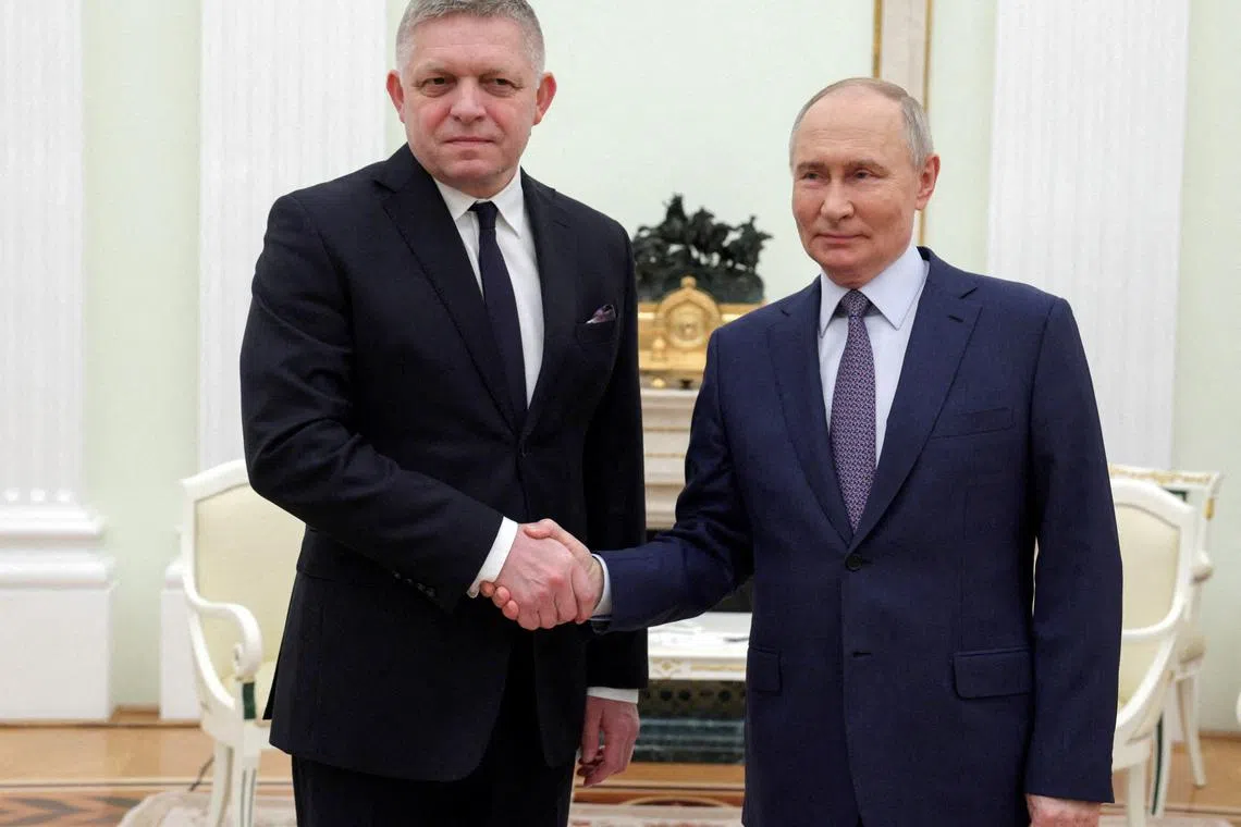 FILE PHOTO: Russian President Vladimir Putin shakes hands with Slovak Prime Minister Robert Fico during a meeting in Moscow, Russia December 22, 2024. Sputnik/Gavriil Grigorov/Pool via REUTERS/File Photo