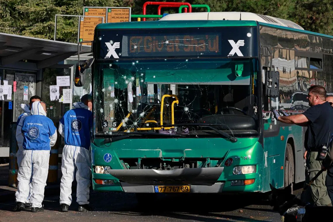 The explosions, about 30 minutes apart, appeared to be a Palestinian attack, Israeli police said.