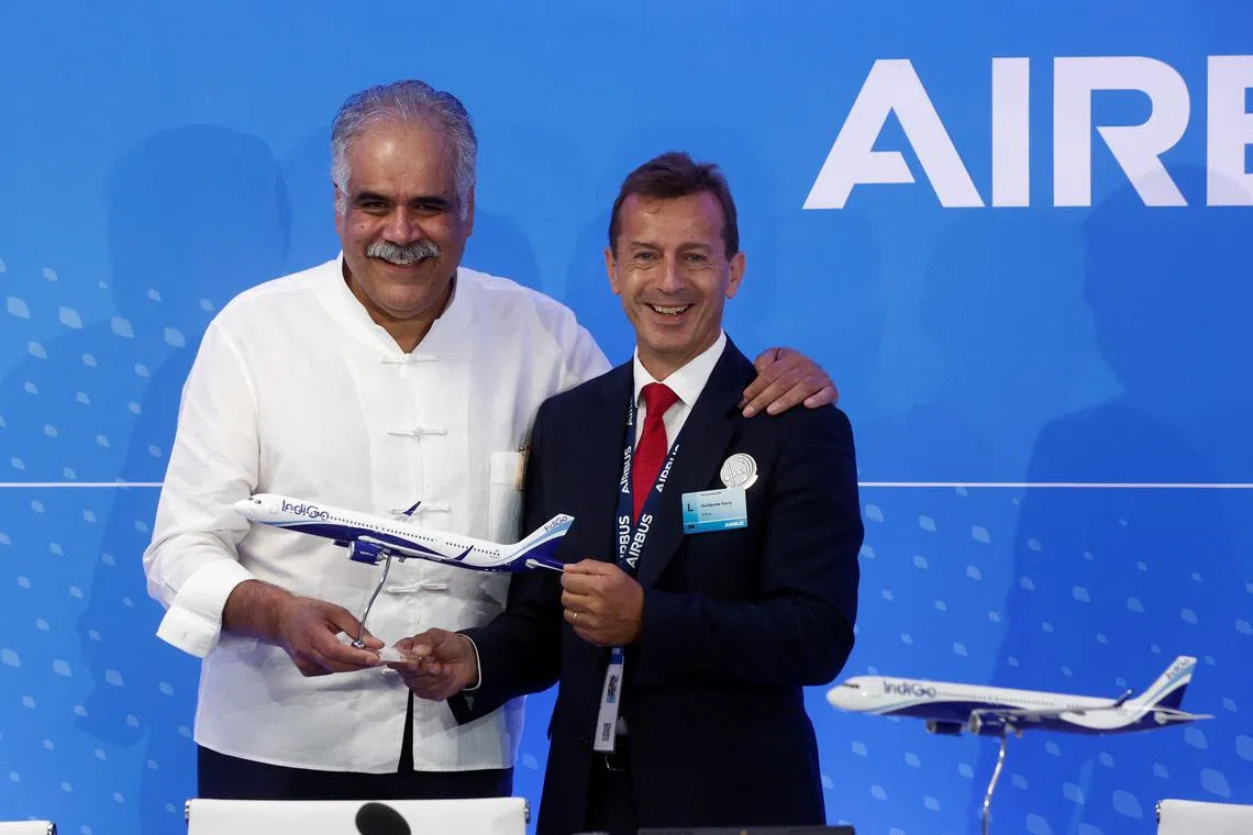 Rahul Bhatia, Managing Director of IndiGo and Guillaume Faury, CEO of Airbus, seen after the purchase agreement.