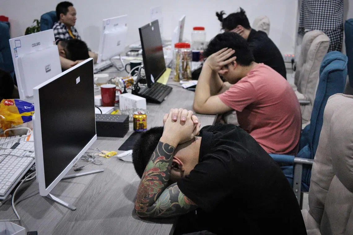 Chinese nationals arrested during a police raid on suspicion of running an online love scam syndicate in Batam.