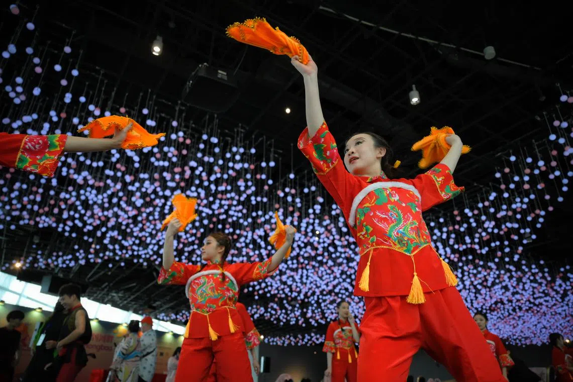 Performers from the dance department of the National Taiwan University of Physical Education and Sport performing their piece, titled “Welcome the Arrival of Spring with Hankerchiefs” during the media preview for the River Hongbao 2024, held at Gardens by the Bay on Feb 7, 2024.