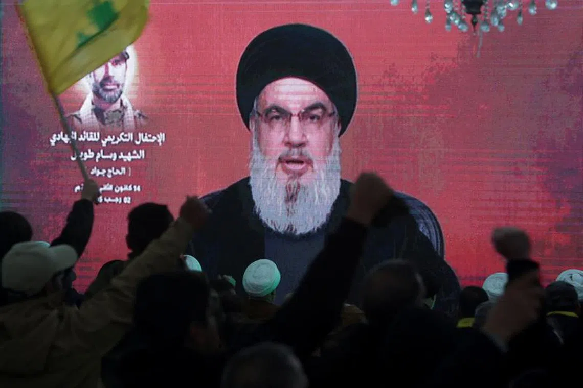 FILE PHOTO: Lebanon's Hezbollah leader Sayyed Hassan Nasrallah gives a televised address at a memorial ceremony to mark one week since the killing of Wissam Tawil, a commander of Hezbollah's elite Radwan forces, in Khirbet Silem, southern Lebanon, January 14, 2024. REUTERS/Aziz Taher/File Photo