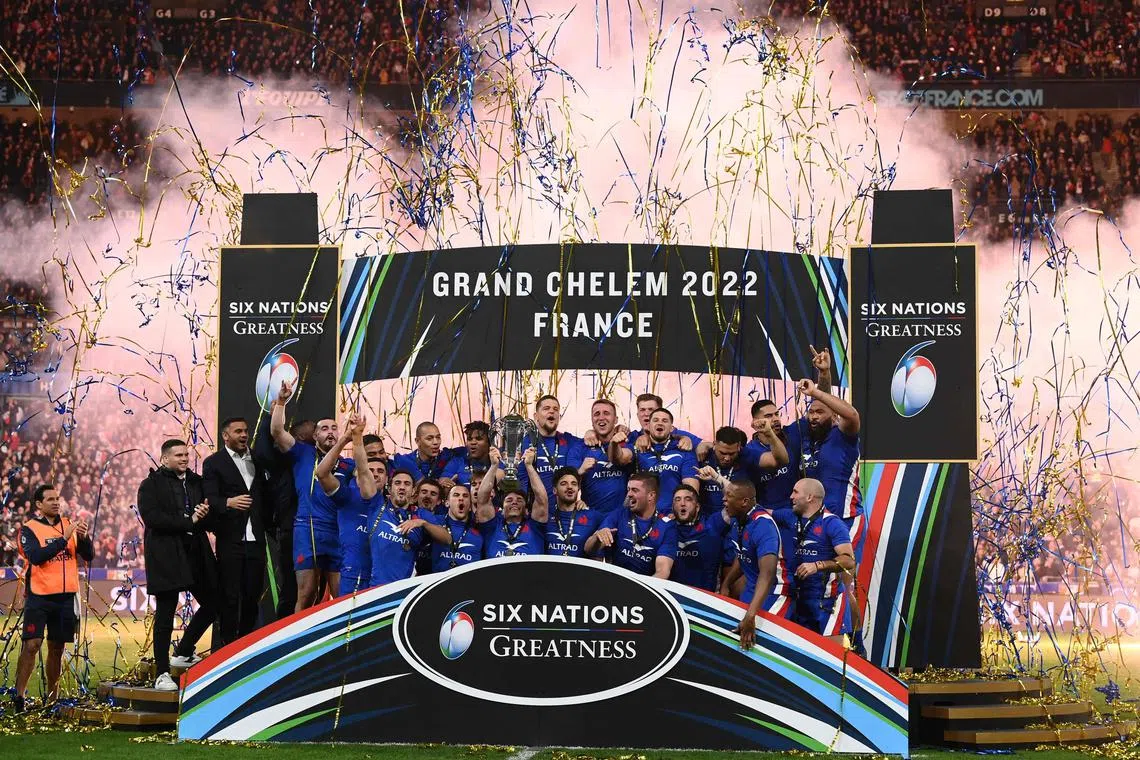 France's players celebrate with the trophy after winning the 2022 Six Nations rugby union tournament.