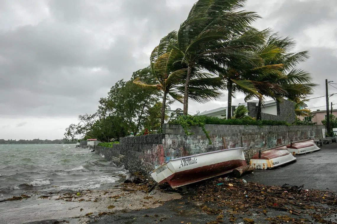 Images from the island showed waves crashing to the shore and the wind whipping through palm trees.