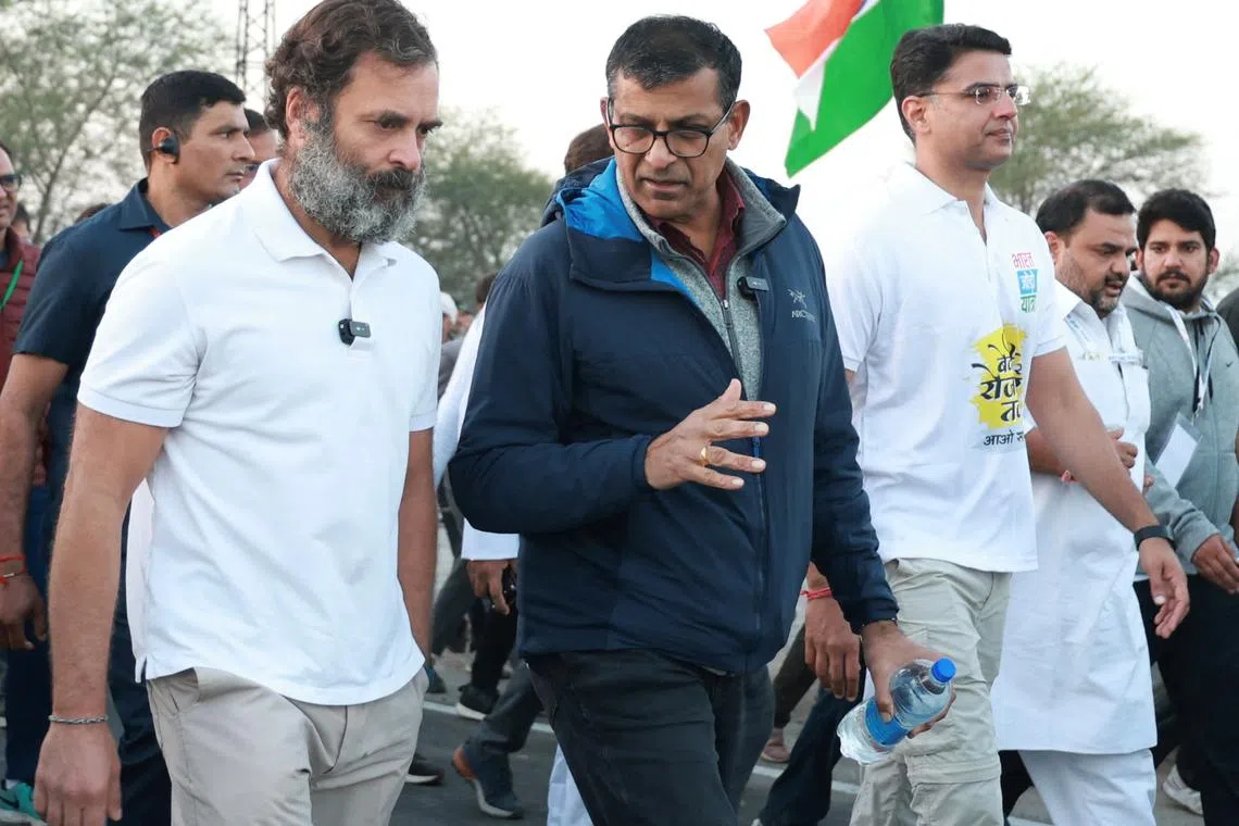 Opposition leader Rahul Gandhi walks with former India central bank chief Raghuram Rajan on Dec 14, 2022.