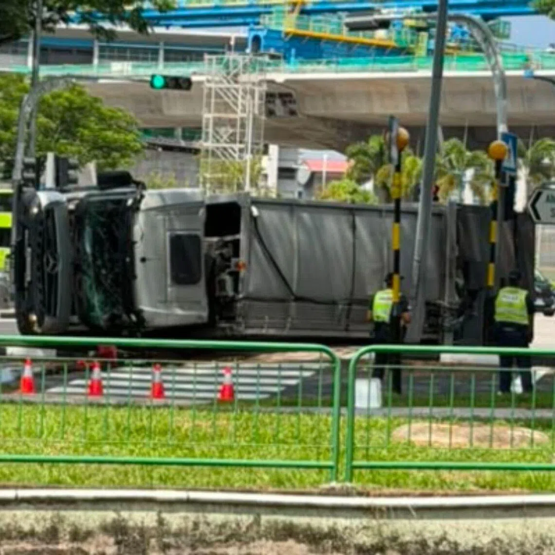 A garbage truck driver and his two passengers were taken to hospital after the accident.