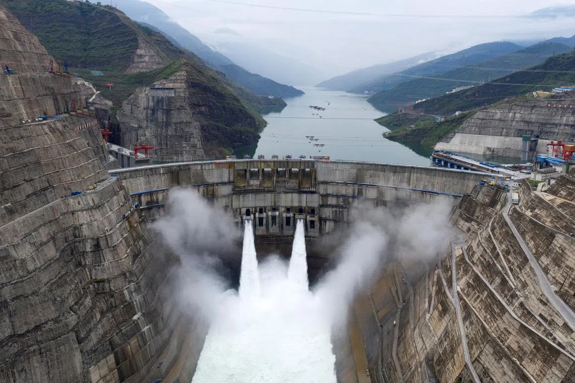 FILE PHOTO: The Baihetan hydropower plant is seen in operation on the border between Qiaojia county of Yunnan province and Ningnan county of Sichuan province, China June 28, 2021. Picture taken with a drone. cnsphoto via REUTERS   ATTENTION EDITORS - THIS IMAGE WAS PROVIDED BY A THIRD PARTY. CHINA OUT./File Photo