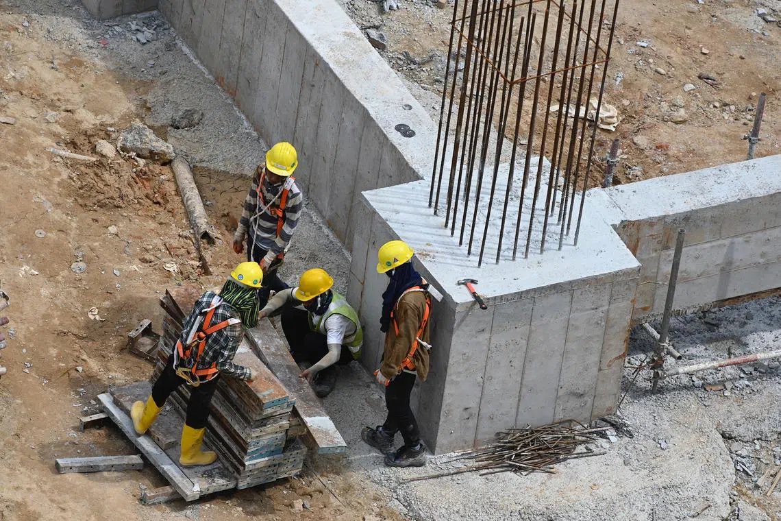 pixgeneric/ Generic picture of foreign migrant construction workers in Dakota One BTO construction site on 1 September 2022 . 
Work place safety and health Act . 
The Ministry of Manpower is imposing a period of "heightened safety" from Sept 1, 2022 to Feb 28, 2023 to stem the tide of workplace deaths
 • A company can be barred from employing new foreign employees for up to three months if found to have poor safety conditions after a serious or fatal accident
 • It will also be mandatory for companies in industries such as construction and manufacturing to review their safety procedures from Sept 1 to 15
 • MOM will increase the demerit points issued to construction firms for major injury and dangerous occurrences.