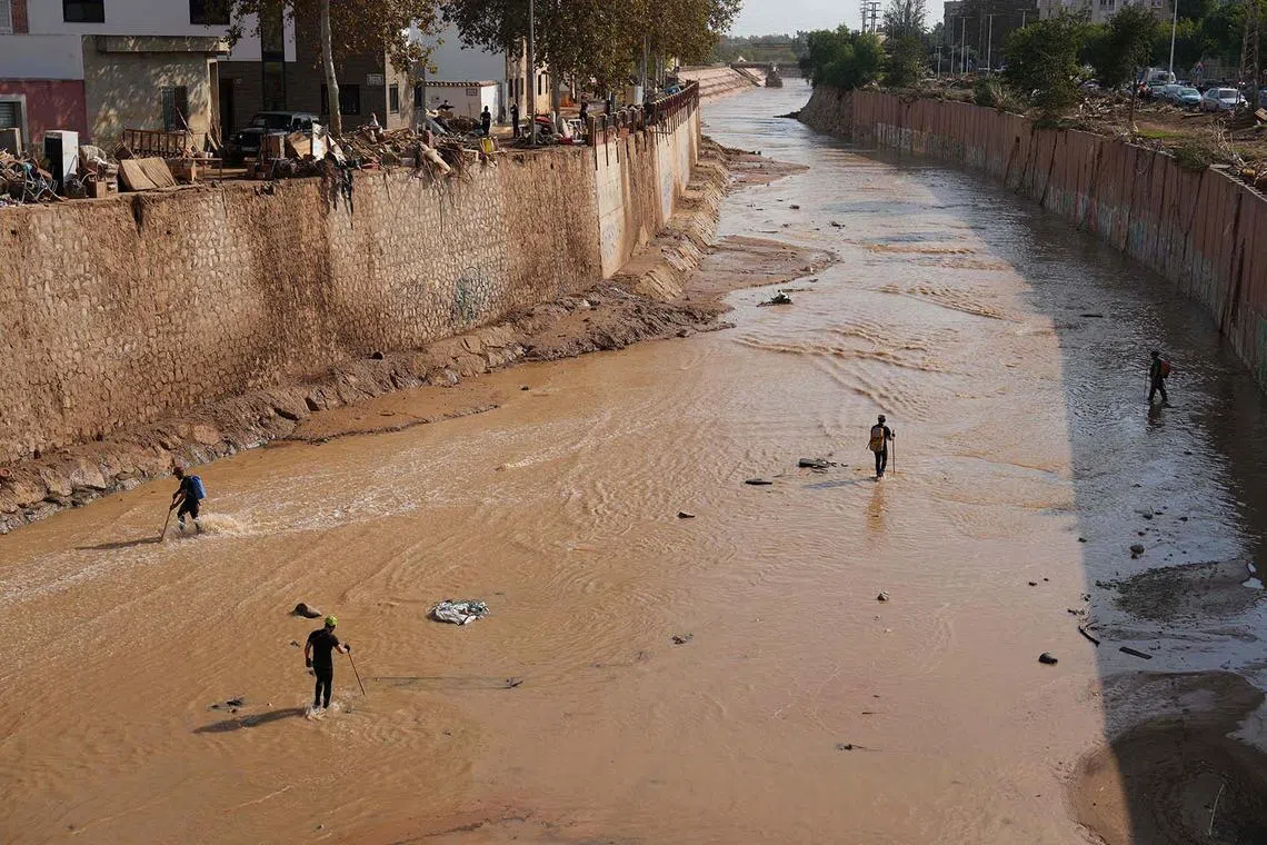Spain's Civil Guard searching for victims in Catarroja, in the region of Valencia, eastern Spain, on Nov 6, 2024, in the aftermath of deadly floods. 