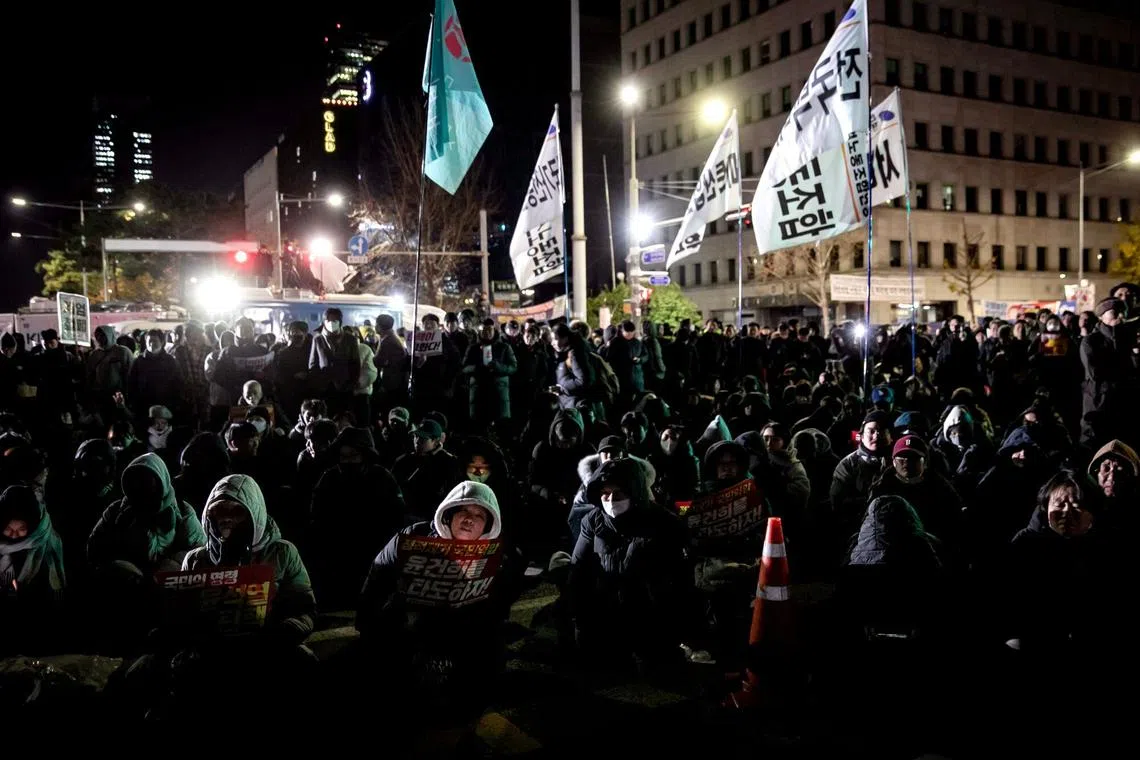 Protesters against South Korean President Yoon Suk Yeol's declaration of martial law on the street outside the National Assembly in Seoul, on Dec 4.