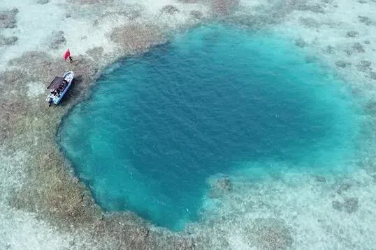 Rare coral reef blue hole found in South China Sea