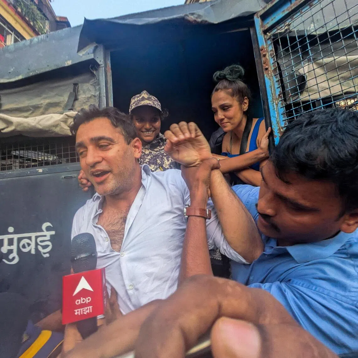 Bollywood actor Imran Khan is detained by security personnel during a protest by the Cockroach Janta Party (CJP) seeking the resignation of India's Chief Election Commissioner Gyanesh Kumar, in Mumbai, India, October 10, 2026. REUTERS/Stringer