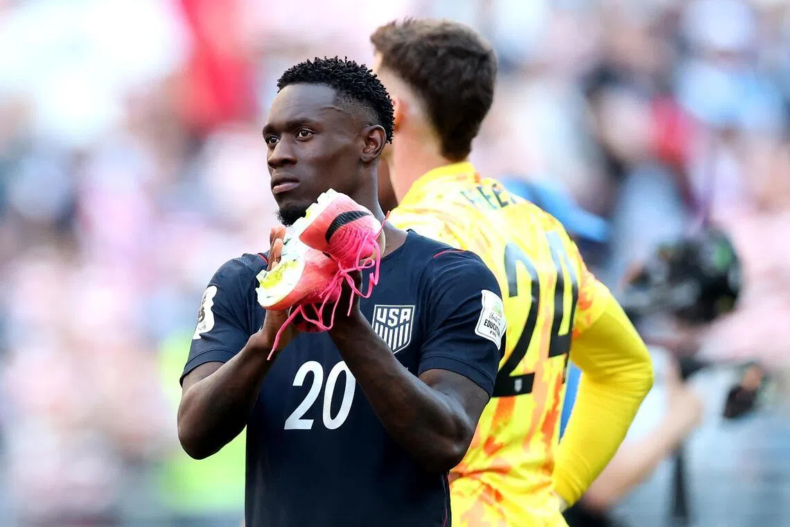 US striker Folarin Balogun applauding fans after their 4-1 loss to Belgium in the World Cup’s last 16 on July 6.