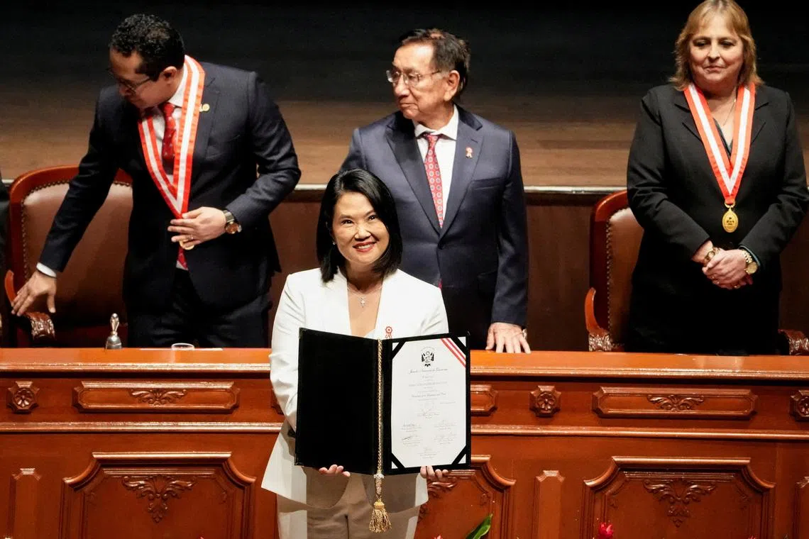 Peru’s President-elect Keiko Fujimori holds her official credentials, following her victory in the presidential run-off in Lima, Peru, on July 15.