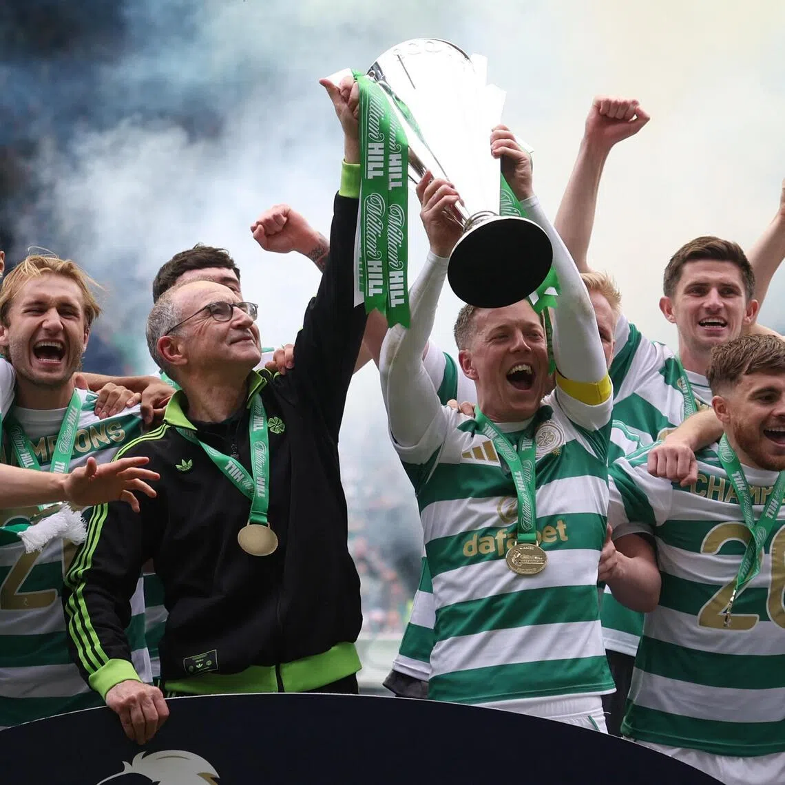 Celtic manager Martin O'Neill and captain Callum McGregor celebrate lifting the Scottish Premiership trophy after beating Heart of Midlothian at Celtic Park in  Glasgow on May 16, 2026.