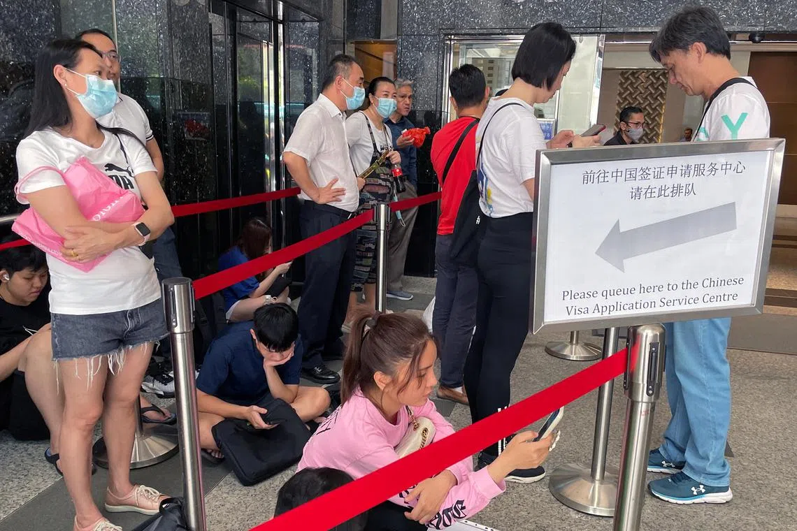 A queue outside the Chinese Visa Application Service Centre in Singapore on March 15.