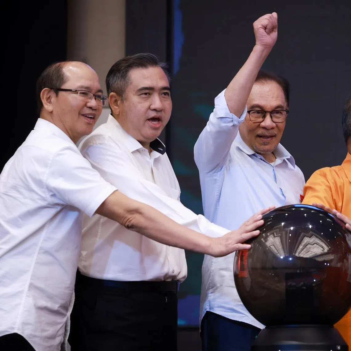 Democratic Action Party secretary-general Anthony Loke (left) said the party could leave Pakatan Harapan chairman Anwar Ibrahim's (middle) Cabinet.
