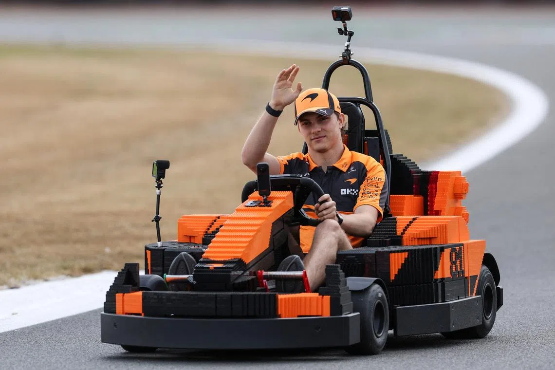 Formula One F1 - British Grand Prix - Silverstone Circuit, Silverstone, Britain - July 5, 2026 McLaren's Oscar Piastri in a car made of Lego blocks ahead of the race REUTERS/Andrew Boyers