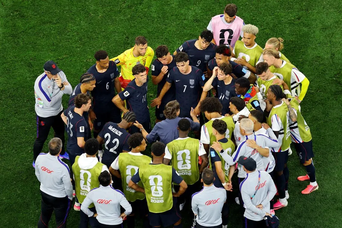 US coach Mauricio Pochettino speaking to his players during a hydration break during their World Cup match against Turkey on June 25.
