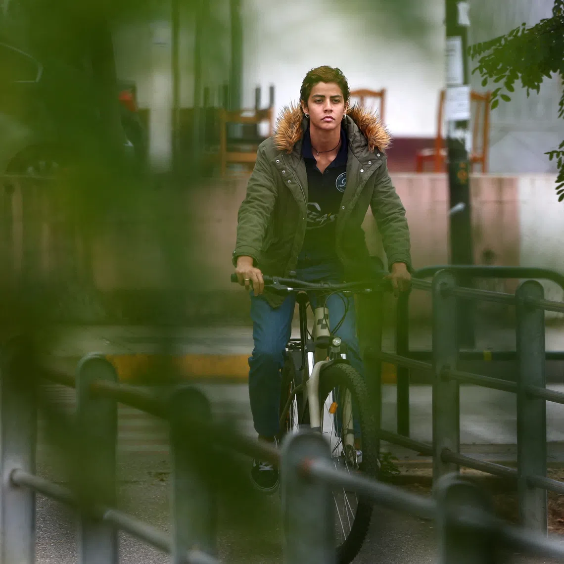 Brazilian volleyball player Nayara Ferreira rides her bicycle after she was banned from playing for the Albanian Volleyball Federation for not taking a gender test, in Tirana, Albania, November 3, 2025. REUTERS/Florion Goga