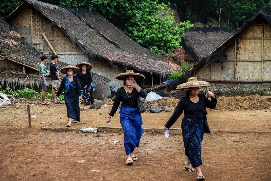 Members of the indigenous Baduy tribe walking to a polling station to cast their ballots and vote in Indonesia’s presidential and legislative elections in Kanekes Village, Lebak, Banten province on Feb 14, 2024.