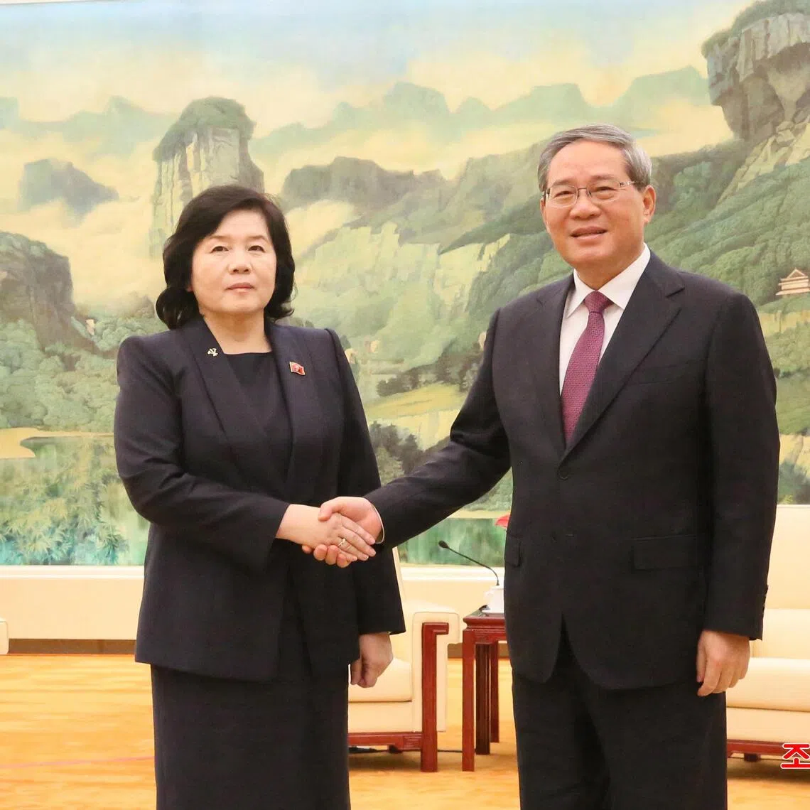 This undated picture released by North Korea's official Korean Central News Agency (KCNA) on September 30, 2025 shows North Korea's Foreign Minister Choe Son Hui (L) shaking hands with Chinese Premier Li Qiang (R) at the Great Hall of the People in Beijing. (Photo by KCNA VIA KNS / AFP) / South Korea OUT / ---EDITORS NOTE--- RESTRICTED TO EDITORIAL USE - MANDATORY CREDIT "AFP PHOTO/KCNA VIA KNS" - NO MARKETING NO ADVERTISING CAMPAIGNS - DISTRIBUTED AS A SERVICE TO CLIENTS
THIS PICTURE WAS MADE AVAILABLE BY A THIRD PARTY. AFP CAN NOT INDEPENDENTLY VERIFY THE AUTHENTICITY, LOCATION, DATE AND CONTENT OF THIS IMAGE. / 
