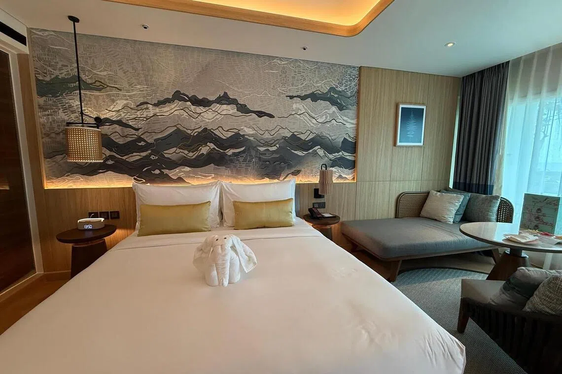The Deluxe Ocean View Room is spacious and comfortable, with large windows and a private balcony overlooking the sea.