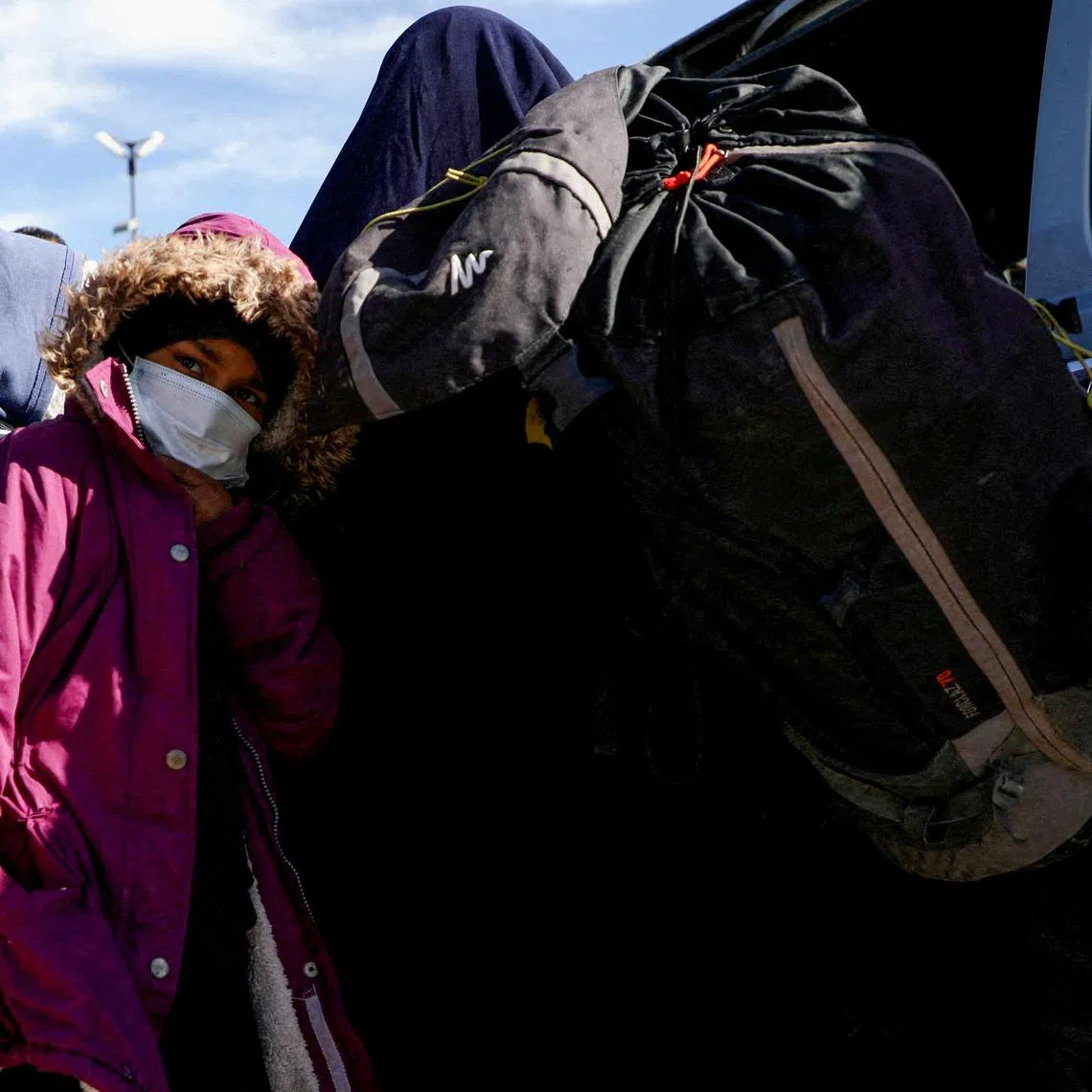 Members of Australian families believed to be linked to the Islamic State militants leave Roj camp near Derik, Syria February 16, 2026. The families later returned to the detention center due to \"technical reasons,\" two sources told Reuters. REUTERS/Orhan Qereman