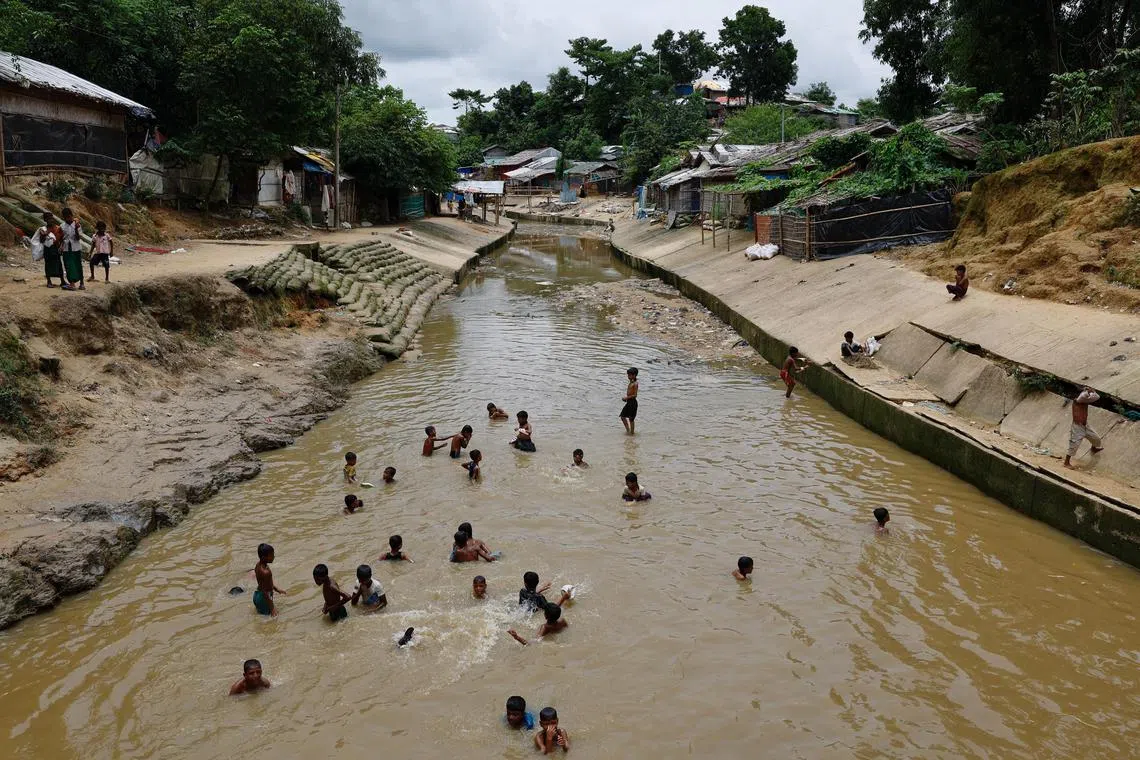 Rohingya refugee children bathing in a stream at the Kutupalang refugee camp in Cox's Bazar, Bangladesh, on June 26. A UN fact-finding mission concluded that a 2017 military campaign by Myanmar that drove 730,000 Rohingya into Bangladesh had included “genocidal acts”.
