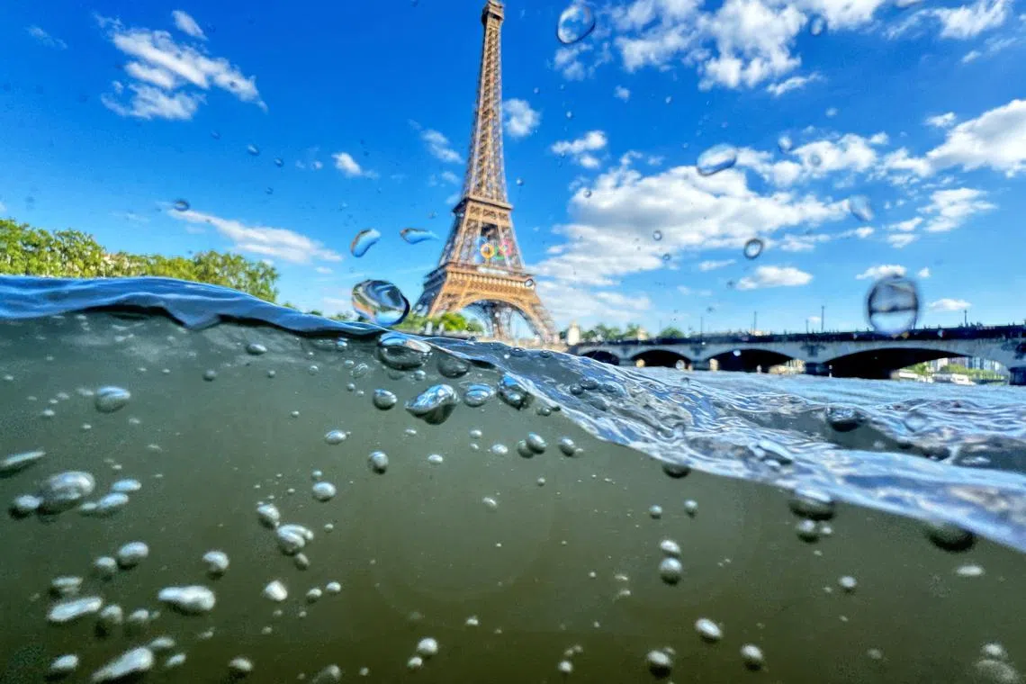 FILE PHOTO: Paris 2024 Olympics - Paris, France - June 23, 2024 The Eiffel Tower is seen from the water of the Seine River as the Olympics opening ceremony rehearsal is postponed amid rainy weather. REUTERS/Pawel Kopczynski/File Photo