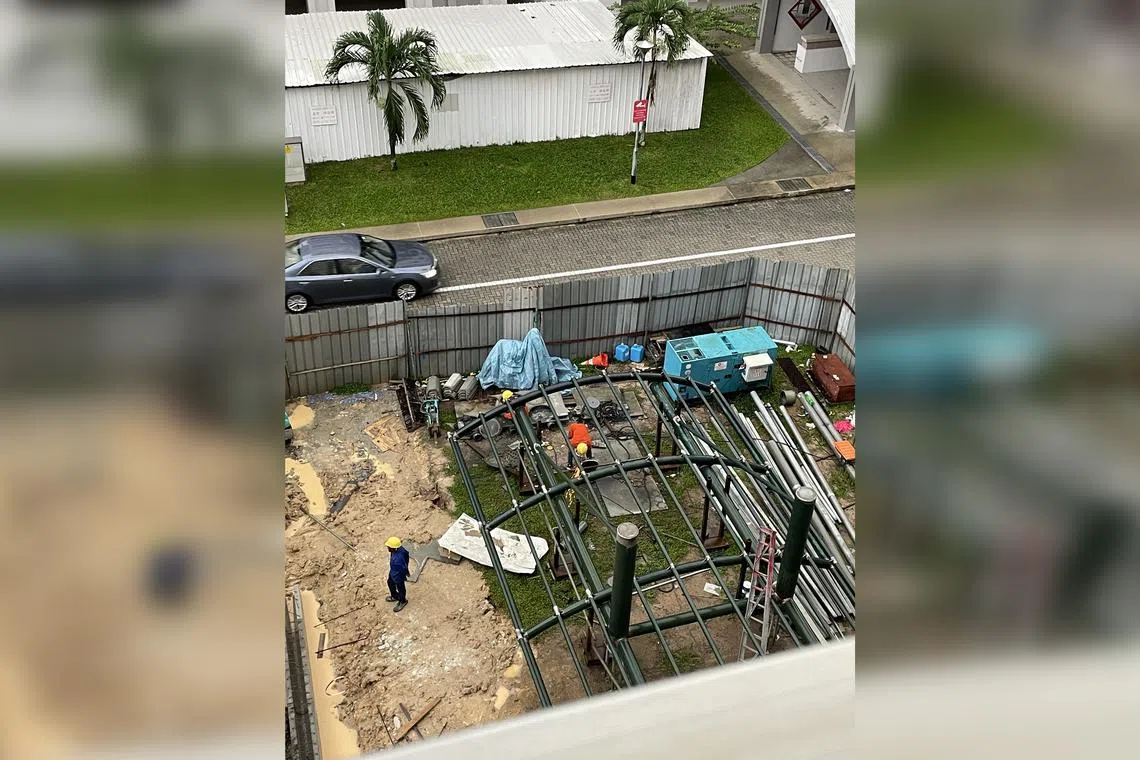 Construction workers at Block 267 Pasir Ris Street 21. The writer wonders if the metal works should be done in a factory instead.