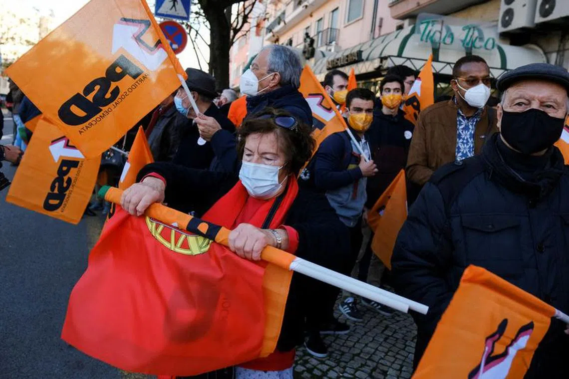FILE PHOTO: People wait for Portugal's Social Democratic Party (PSD) leader Rui Rio to arrive for a campaign rally for Portugal's snap elections, in Lisbon, Portugal, January 17, 2022. REUTERS/Pedro Nunes/File Photo