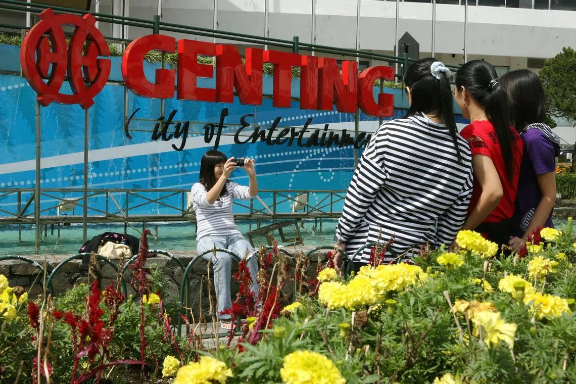 Tourists take photographs at Genting Bhd's Genting Resorts Hotel in the Genting Highlands, Selangor, Malaysia, on Tuesday, June 16, 2009. Genting Bhd., Asia's largest listed casino operator, bought a 3.2 percent stake in MGM Mirage for $100 million, MGM spokesman Gordon Absher said on June 10. Photographer: Goh Seng Chong/Bloomberg News