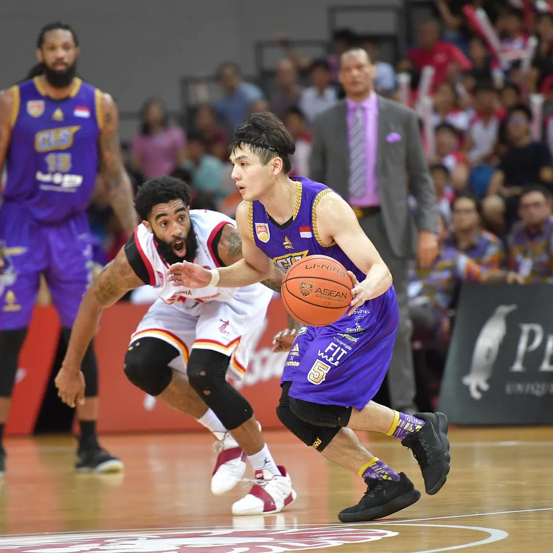 CLS Knights Indonesia's Wong Wei Long went past Singapore Slingers' Jerran Young on 15 May 2019. CLS Knights Indonesia are champion after beating Singapore Slingers 84-81 in the Asean Basketball League Finals decider on 15 May 2019 at OCBC Arena Hall 1 on 15 May 2019.