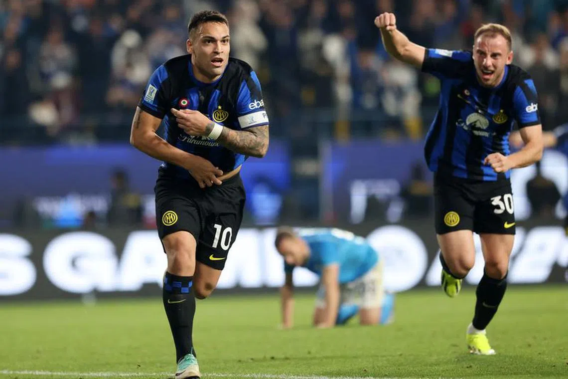 Soccer Football - Supercoppa Italiana - Final - Napoli v Inter Milan - Al Awwal Stadium, Riyadh, Saudi Arabia - January 22, 2024  Inter Milan's Lautaro Martinez celebrates scoring their first goal with Carlos Augusto REUTERS/Ahmed Yosri