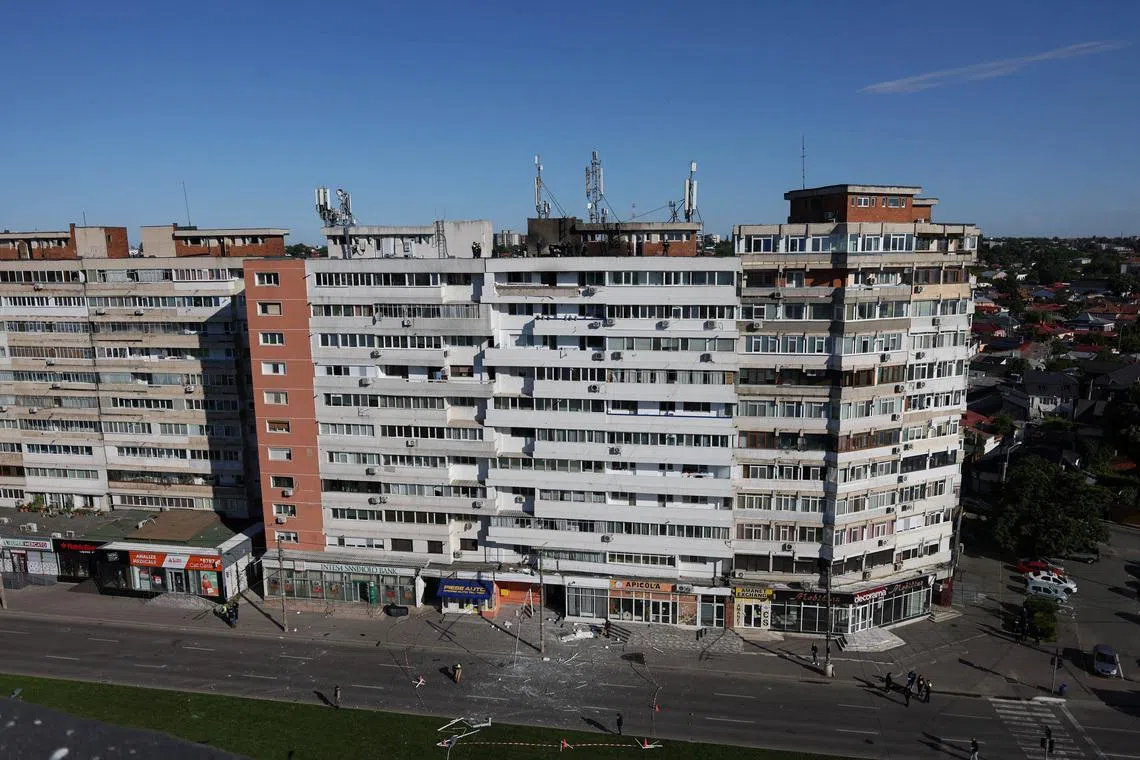 Romanian law enforcement officers work on the site of an explosion at a residential block of flats following a drone hit close to the border with Ukraine, in Galati, Romania, May 29, 2026. Inquam Photos/George Calin via REUTERS