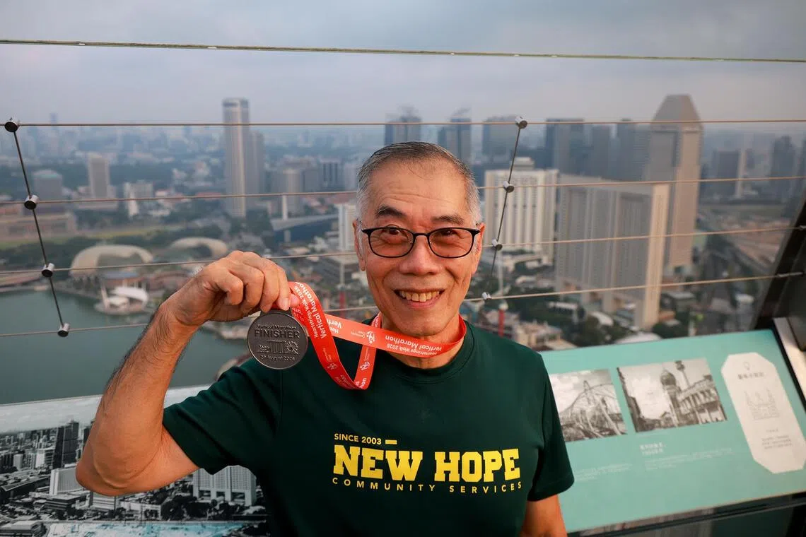 Pastor Andrew Khoo with his finisher’s medal.