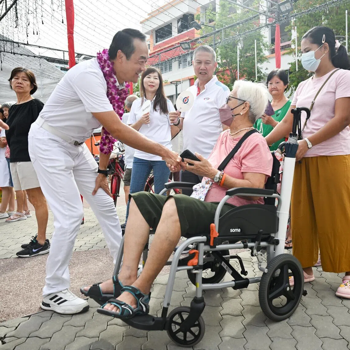 Dr Koh Poh Koon interacting with residents during a thank you walkabout with other Tampines GRC candidates on May 4, 2025. 
